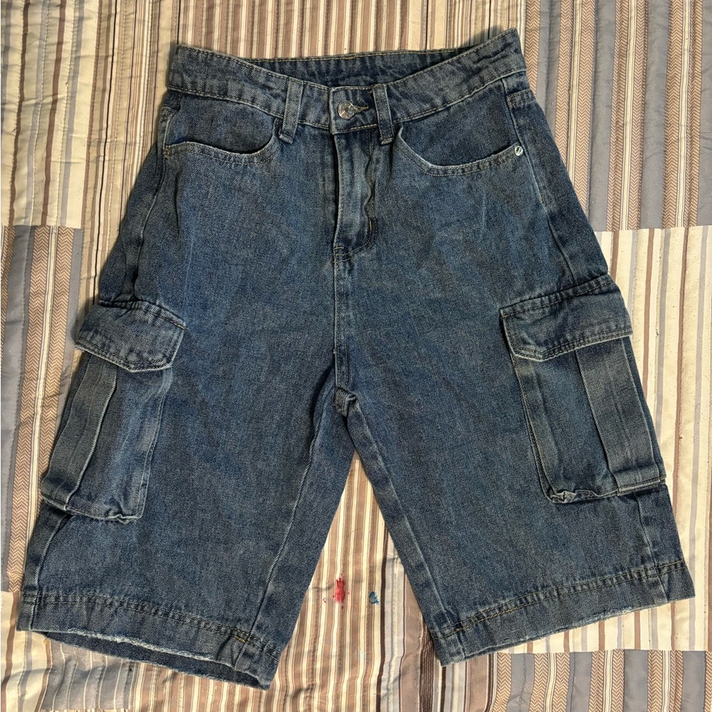 Mid- rise denim jorts with flap pockets